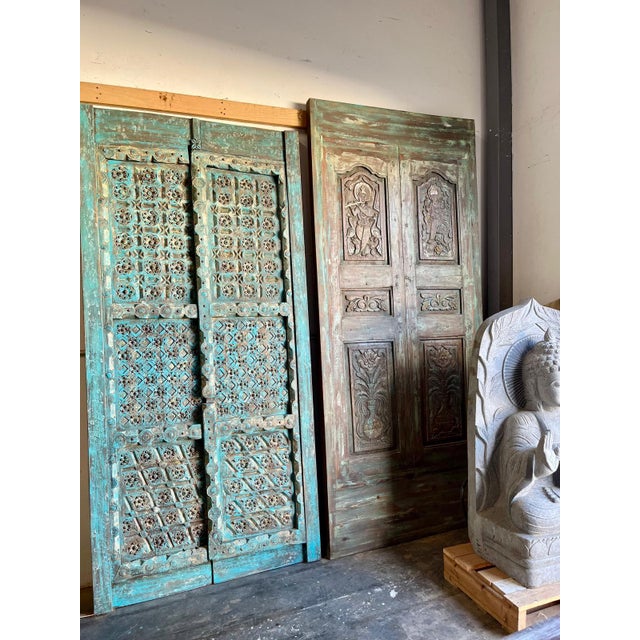 Add timeless farmhouse charm to your space with these Rustic Blue Antique Carved Wood Double Doors, beautifully accented...