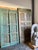 Add timeless farmhouse charm to your space with these Rustic Blue Antique Carved Wood Double Doors, beautifully accented...