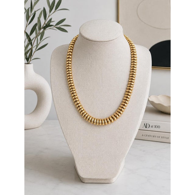 A striking vintage Italian Tubogas collar necklace crafted in rich 14 karat yellow gold, dating to circa 1975. This...