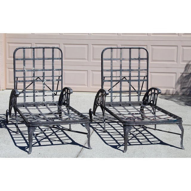 Make a bold architectural statement in your outdoor space with this pair of vintage cast aluminum patio chaise lounge...