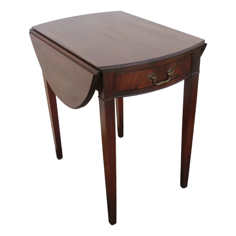 Brown wooden table with one drawer and drop-leaf sides