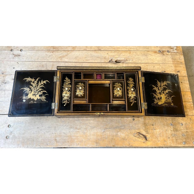 Chinese export, circa 1820. An exceptional quality and rare form. Featuring figural landscape decorations in gilt to the...