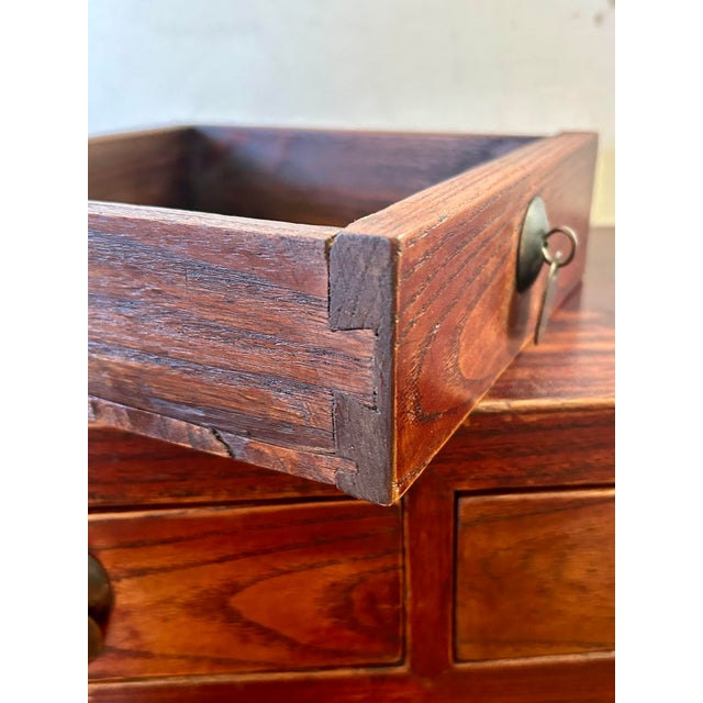 Hand carved low Asian altar table with four drawers. Dove-tail construction throughout with metal toggle pulls for...