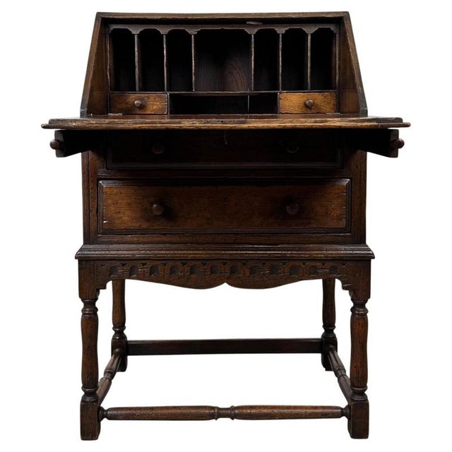 A beautifully crafted and particularly fine quality 20th-century oak bureau, combining an elegant fitted writing interior...