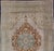 Measures: 6'10 x 10'5 This softly colored Oushak carpet rests beautifully upon a field of elegant light taupe. A large...