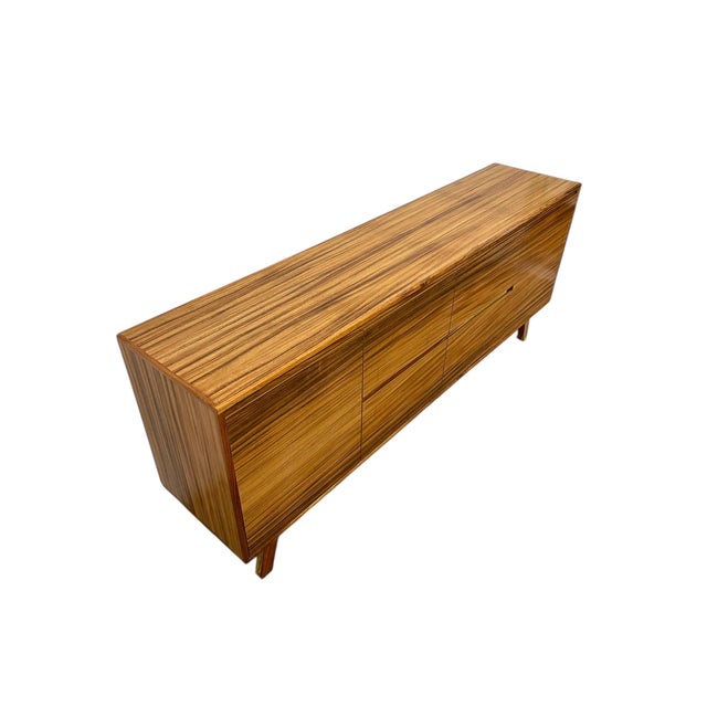 Mid century modern style credenza made using pine wood and parota wood veneer. Light and sturdy construction Note: wood...