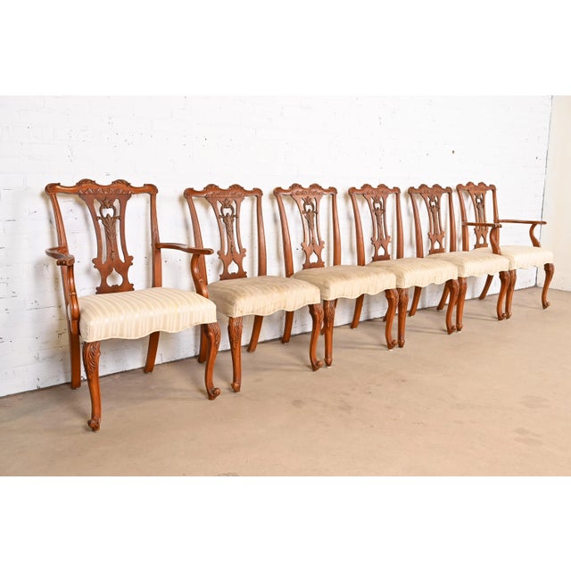 A stylish set of six French Provincial Louis XV style dining chairs By Romweber USA, Circa 1920s Beautiful carved exotic...