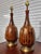 Pair of mid-century modern drip glaze table lamps. Brown tones throughout the glaze. This pair has a brass finish at the...