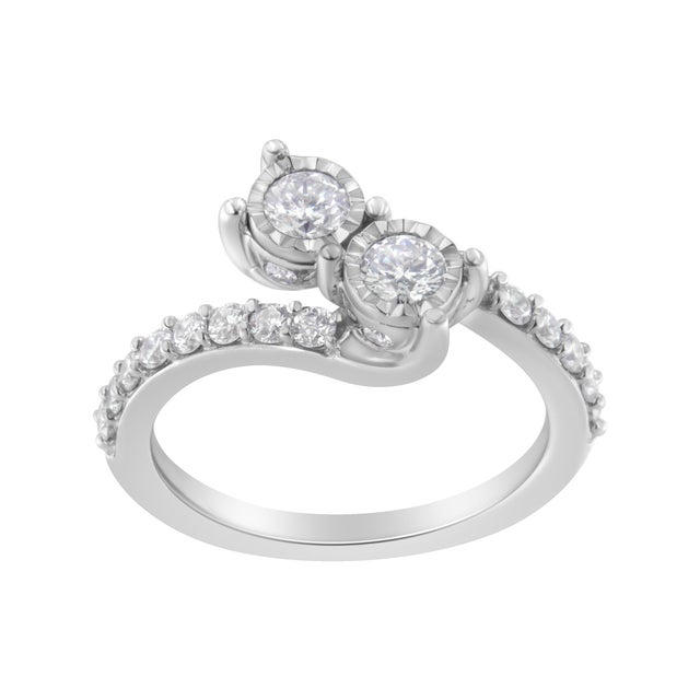 Celebrate your life together with this exquisite two-stone diamond ring. Crafted in 10k white gold, this exquisitely...