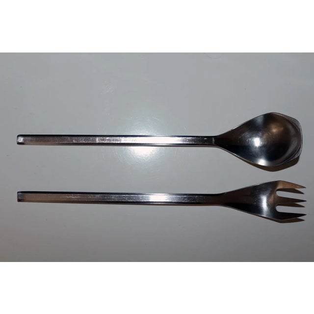 2-piece salad servers by Helmut Alder for Anvil, 1963, stainless steel, each piece hallmarked, model number 2090 This...