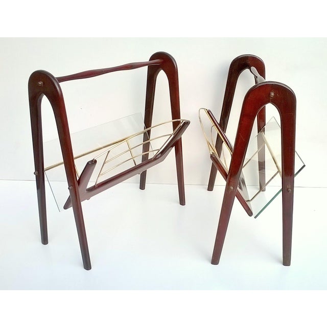 Rare set of two magazine racks designed by Cesare Lacca,1950s. Beech wood stained mahogany. Side glass. Very good...