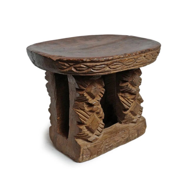 Authentic hand carved Bamileke tribal wood pedestal stool. Masterfully crafted from one piece of indigenous wood....