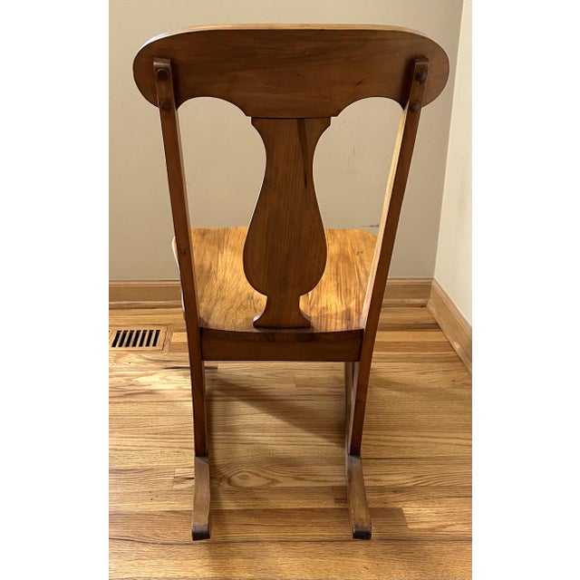 The finish is strikingly beautiful on this hand-crafted rocking chair. It appears to be from the mid-20th century and...