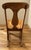 The finish is strikingly beautiful on this hand-crafted rocking chair. It appears to be from the mid-20th century and...