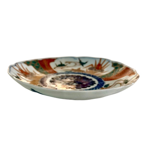 A beautiful Japanese Imari porcelain plate dating to the turn of the 20th century, expertly hand decorated in the...
