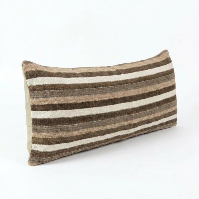 This beautiful 16'' x 58'' hand-woven Kilim pillow cover was made from an authentic Turkish kilim. The traditional flat-...