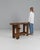 This 20th Century French wooden work table reflects the practical beauty of traditional artisan furniture. Built from...