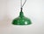 Industrial green enamel factory pendant light made in United Kingdom during the 1960s. White enamel inside the shade. Iron...