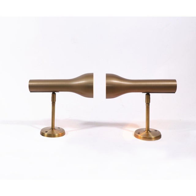 Elegant pair of brass wall spots designed by Lad Team for Swiss Lamps International, Zürich in the 1960s. Lighting: each...