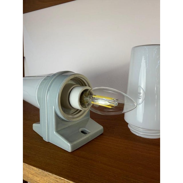 A timeless classic of Scandinavian design: This elegant wall lamp was designed in the 1960s by renowned Swedish designer...