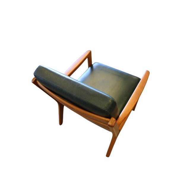 An elegant and incredibly comfortable Danish lounge chair in teak, model Senator 169, designed by Ole Wanscher and...