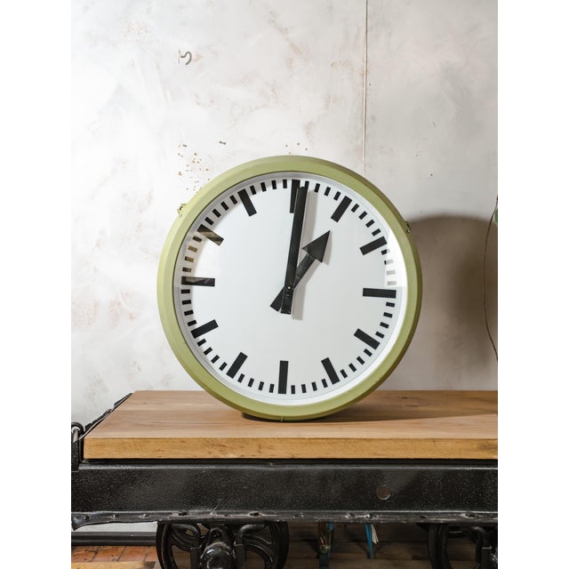 A double-faced illuminated railway station clock by rft (rundfunk- und fernmelde-technik), made in germany and fully...