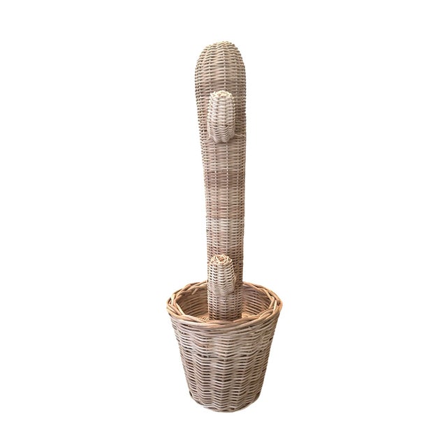 A quirky, vintage wicker cactus sculpture. Features a hand woven wicker rattan cactus in pot. Unmarked. Circa 1970.