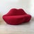 Two-seater sofa in the bocca style, designed by studio 65, with a lip-shaped frame and red fabric upholstery. high-density...