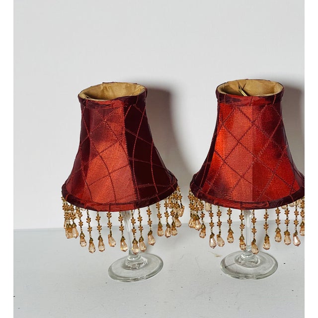 Beautiful vintage clip on lamp shades in vine red silk with crystal beads fringes.