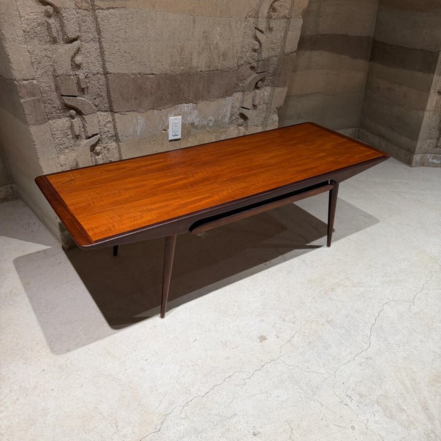 For your consideration, a danish mid-century modern teak coffee table with a pull out extension. Stamped: Aase Dreieri, a...