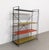Vintage freestanding Tomado shelving unit with a metal structure and coloured metal shelves. Each shelf can be positioned...