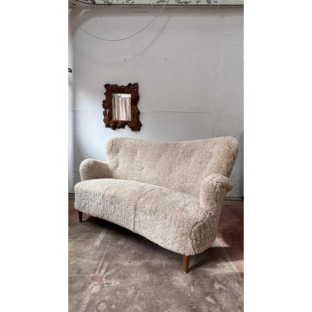 A gorgeous and classic small sofa or loveseat, that would look great in any home. The smooth organic shape, coupled with...