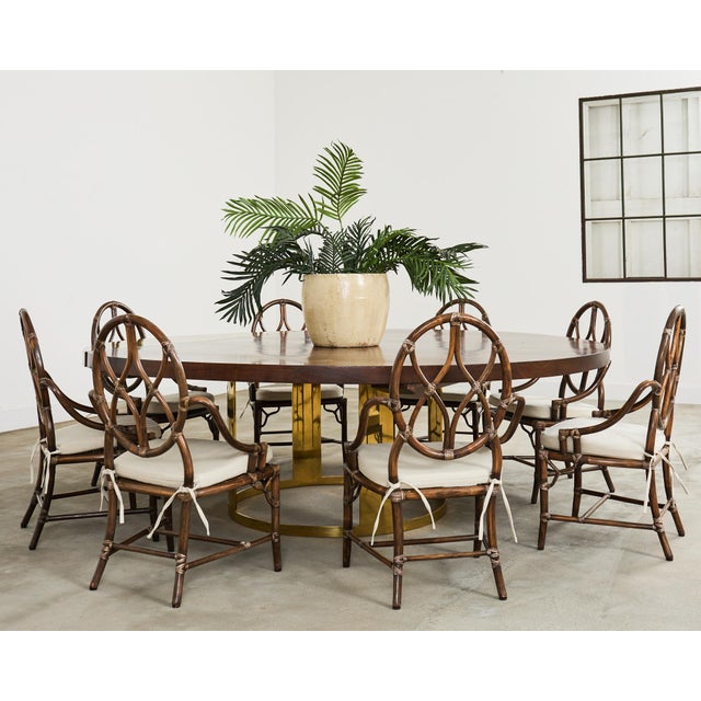 Grand bespoke one-off round walnut and brass dining or center table designed by Juan Pablo Molyneux. Constructed on a...