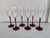 Set of 6 champagne glasses. Red foot and stem clear bowl. Standing 8.75” tall , base is 2.75” and a rim of 2” diameter.