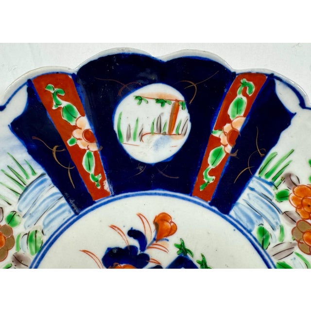 Japanese Large Antique Scalloped Edge Porcelain Imari Plate Decorated With Rich Colored Floral & Landscape Scenes From Japan - Circa 1880 For Sale - Image 3 of 11