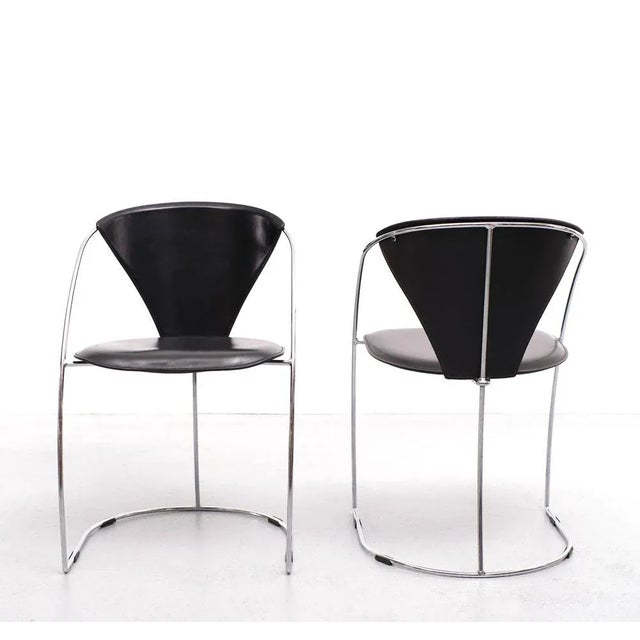 Arrben dining chairs. Model linda made in Italy 1980s. Chrome on steel frame, comes with a black leather upholstery. One...