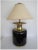 A relatively large Post-Modern black glazed ceramic and brass table lamp by Chapman, circa 1980s. Table lamp Includes...