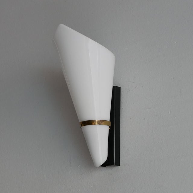 Pair of brass and acrylic glass wall sconces. Italian design from the 1950s. In the style of Arteluce, Stilnovo, and...