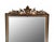 Antique empire beveled mirror in a gorgeous hand carved black wood frame that is gilded in a dore wood floral design. The...