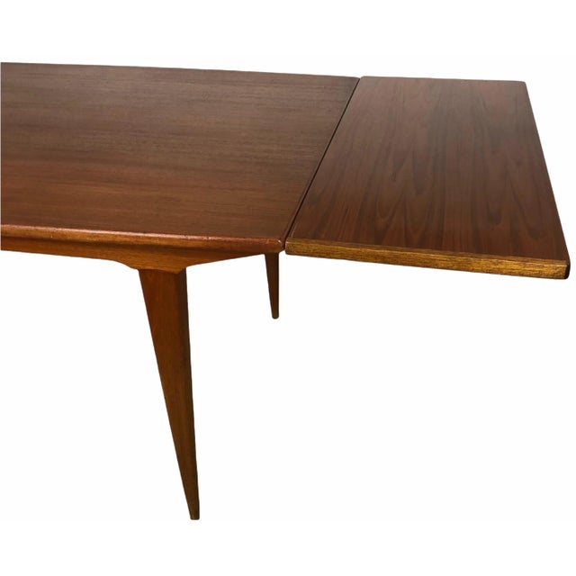 Outstanding combination of versatility and quality in this dining table. The solid teak wood is in very good condition,...