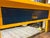 Vintage Large School or Lab Table , or Desk, With Painted Bright Yellow With Blue and Orange Drawers For Sale - Image 12 of 12