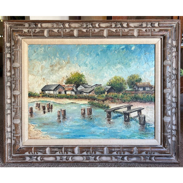 Vintage 1959 impressionist oil painting of a rustic coastal fishing village. Signed and dated to the lower right. In...