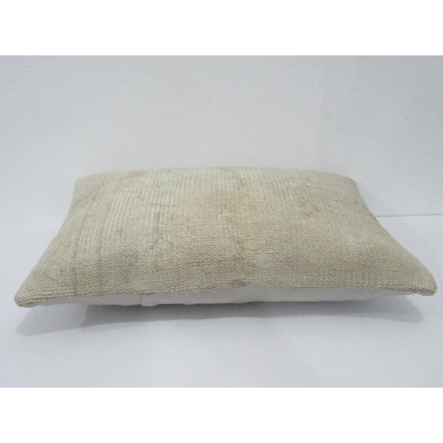 Decorative pillow cover made from a vintage Turkish handknotted rug. Backed with good quality cotton fabric. Pillow...