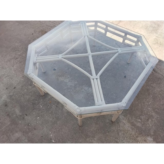 Cream factory finish faux bamboo cocktail table. The glass is new, no scratches. Love the shape, can be reached from any...