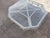 Cream factory finish faux bamboo cocktail table. The glass is new, no scratches. Love the shape, can be reached from any...