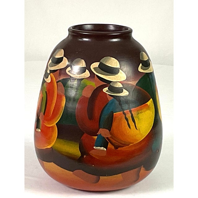 Mexican folk, Art vase, handmade with red clay, and then hand painted Featuring colorful, stylized scenes of locals in...