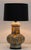 These are so unique and great looking. Heavy textured ceramic ornamented with glazed ceramic carve outs make these lamps...
