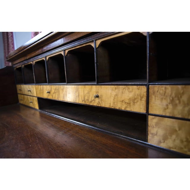 Mahogany bookcase with a folding secretary from the mid-19th century. The upper glass part with a pronounced arch is...