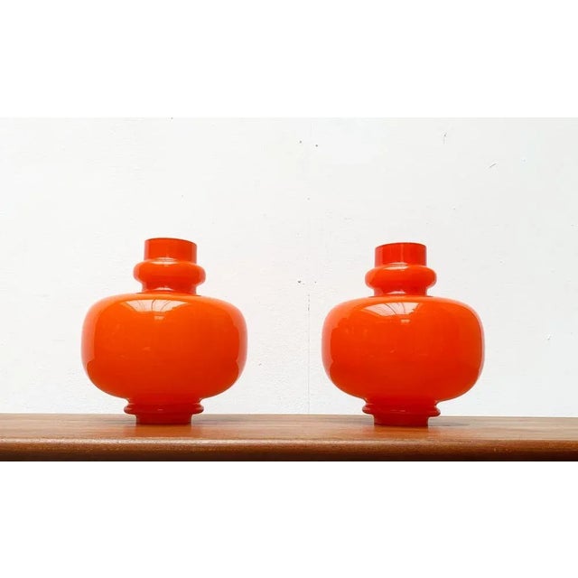 Ornamental glass pendant lights according to a design by Hans-Agne Jakobsson. The diffuser serves a glass of glass with...