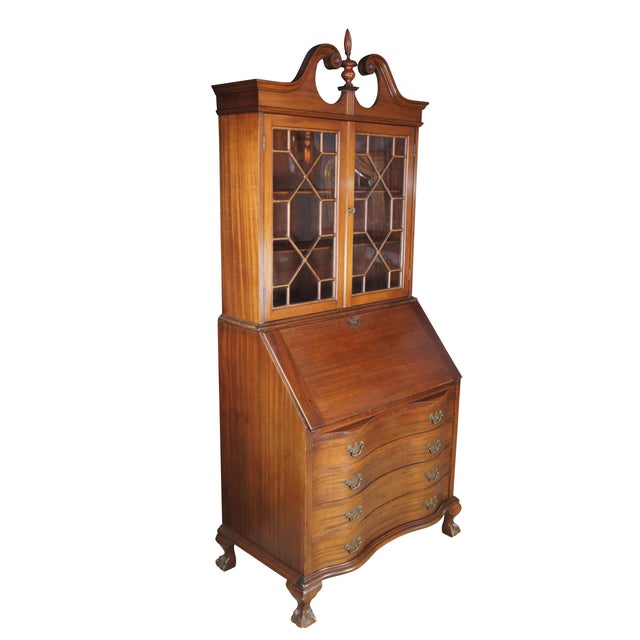 A gorgeous serpentine oxbow secretary desk by Maddox Tables of Jamestown NY. Made from American mahogany. Interior opens...